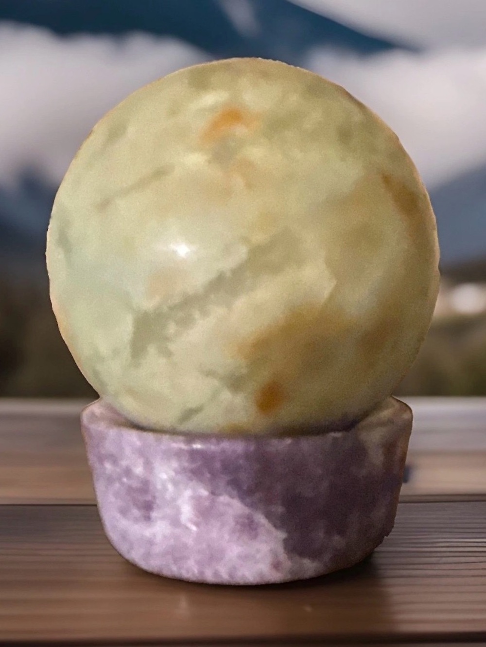 Green Serpentine sphere.
 2 in and 11.9 oz Sphere on Amethyst Stone Stand